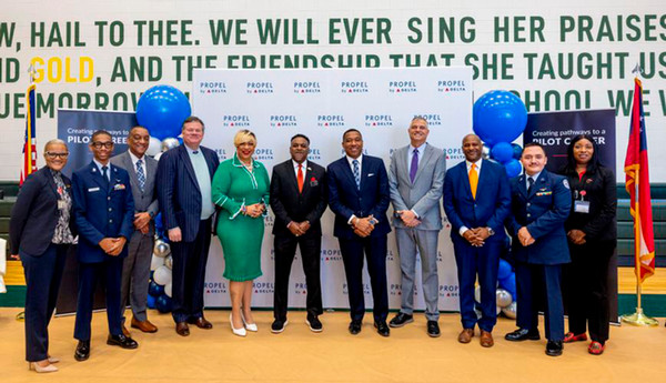 Pictured, from left at Morrow High School Thursday are Monika Wiley (CCPS, Assistant Superintendent), Jonah Slade (Air Force JROTC Cadet Commander & Aviation Program Dual Enrollment Student), Eric Hendrick (Director of Pilot Outreach at Delta), Tad Hutcheson (SVP, The Delta Air Lines Foundation), Alieka Anderson-Henry (Clayton County Chairwoman), Anthony W. Smith (CCPS Superintendent), Douglas Hendrix Sr. (CCPS, Senior Deputy Superintendent – Chief Of Staff), Adon Clark (Dean of School of Aviation, Middle Georgia State University), Benjamin Straker (Chair of the Board, Clayton County Board of Education – District 9), Caleb Gonzales (Air Force JROTC Cadet Lt. Colonel and Aviation Program Dual Enrollment Student) and Dr. Pamela Pitts (CCPS).  SPECIAL PHOTO: DELTA/JASON CROCKETT